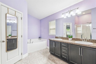 Beautifully maintained and decorated with style, this on Meadow Oaks Golf and Country Club in Florida - for sale on GolfHomes.com, golf home, golf lot