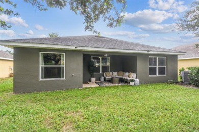 Beautifully maintained and decorated with style, this on Meadow Oaks Golf and Country Club in Florida - for sale on GolfHomes.com, golf home, golf lot