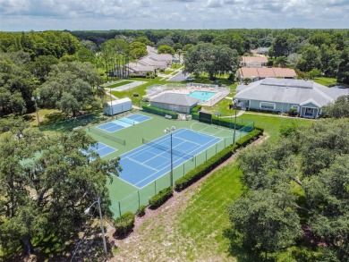 Beautifully maintained and decorated with style, this on Meadow Oaks Golf and Country Club in Florida - for sale on GolfHomes.com, golf home, golf lot