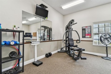 Beautifully maintained and decorated with style, this on Meadow Oaks Golf and Country Club in Florida - for sale on GolfHomes.com, golf home, golf lot