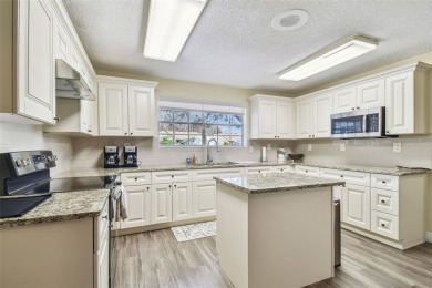 Beautifully maintained and decorated with style, this on Meadow Oaks Golf and Country Club in Florida - for sale on GolfHomes.com, golf home, golf lot