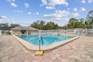 Beautifully maintained and decorated with style, this on Meadow Oaks Golf and Country Club in Florida - for sale on GolfHomes.com, golf home, golf lot