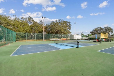 Beautifully maintained and decorated with style, this on Meadow Oaks Golf and Country Club in Florida - for sale on GolfHomes.com, golf home, golf lot
