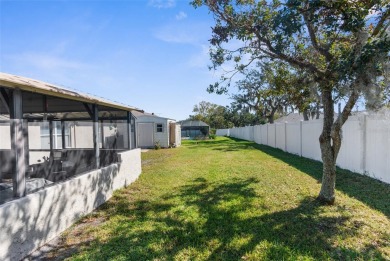 Welcome home to this BEAUTIFULLY MAINTAINED three-bedroom on Spring Hill Golf Course in Florida - for sale on GolfHomes.com, golf home, golf lot