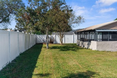 Welcome home to this BEAUTIFULLY MAINTAINED three-bedroom on Spring Hill Golf Course in Florida - for sale on GolfHomes.com, golf home, golf lot