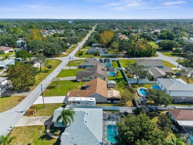 Welcome home to this BEAUTIFULLY MAINTAINED three-bedroom on Spring Hill Golf Course in Florida - for sale on GolfHomes.com, golf home, golf lot
