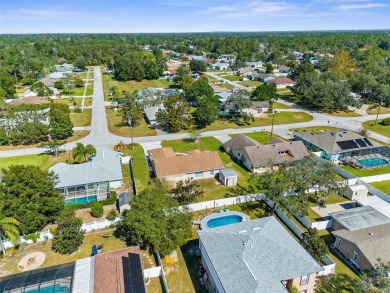 Welcome home to this BEAUTIFULLY MAINTAINED three-bedroom on Spring Hill Golf Course in Florida - for sale on GolfHomes.com, golf home, golf lot