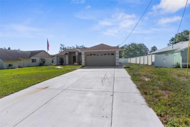Welcome home to this BEAUTIFULLY MAINTAINED three-bedroom on Spring Hill Golf Course in Florida - for sale on GolfHomes.com, golf home, golf lot