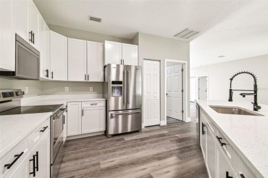 Completely renovated 4-bedroom 3-bathroom home located in on Heritage Harbor Golf and Country Club in Florida - for sale on GolfHomes.com, golf home, golf lot