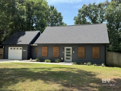 Charming 3-bedroom, 2-bath Creole-inspired home nestled on a on Lake Forest Yacht and Country Club in Alabama - for sale on GolfHomes.com, golf home, golf lot