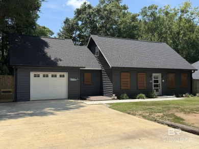 Charming 3-bedroom, 2-bath Creole-inspired home nestled on a on Lake Forest Yacht and Country Club in Alabama - for sale on GolfHomes.com, golf home, golf lot