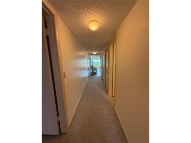 Priced to sell and in need of TLC unusually large condominium on East Bay Golf Club in Florida - for sale on GolfHomes.com, golf home, golf lot