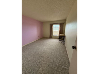 Priced to sell and in need of TLC unusually large condominium on East Bay Golf Club in Florida - for sale on GolfHomes.com, golf home, golf lot