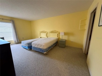 Priced to sell and in need of TLC unusually large condominium on East Bay Golf Club in Florida - for sale on GolfHomes.com, golf home, golf lot