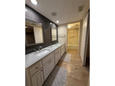 Priced to sell and in need of TLC unusually large condominium on East Bay Golf Club in Florida - for sale on GolfHomes.com, golf home, golf lot