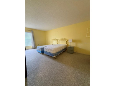 Priced to sell and in need of TLC unusually large condominium on East Bay Golf Club in Florida - for sale on GolfHomes.com, golf home, golf lot