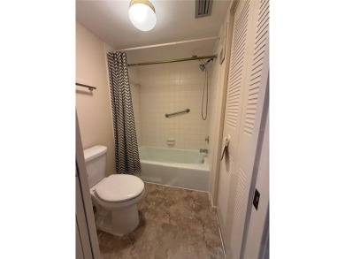 Priced to sell and in need of TLC unusually large condominium on East Bay Golf Club in Florida - for sale on GolfHomes.com, golf home, golf lot