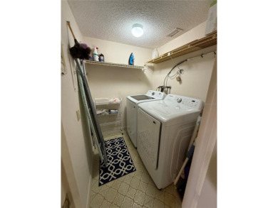 Priced to sell and in need of TLC unusually large condominium on East Bay Golf Club in Florida - for sale on GolfHomes.com, golf home, golf lot
