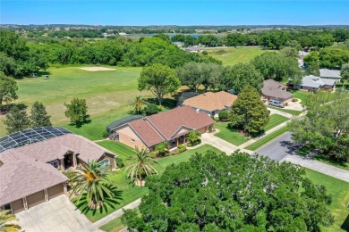 Welcome to this charming golf course home nestled on a vast lot on Green Valley Country Club in Florida - for sale on GolfHomes.com, golf home, golf lot