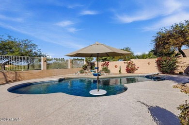 A Botanical Masterpiece Backing to Estrella's Twin Lakes. Set on on Estrella Mountain Ranch Golf Course in Arizona - for sale on GolfHomes.com, golf home, golf lot