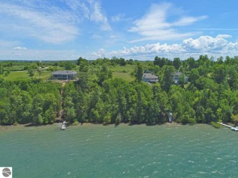 Enjoy 100 ft of Private East Grand Traverse Bay frontage with on Lochen Heath Golf Course in Michigan - for sale on GolfHomes.com, golf home, golf lot