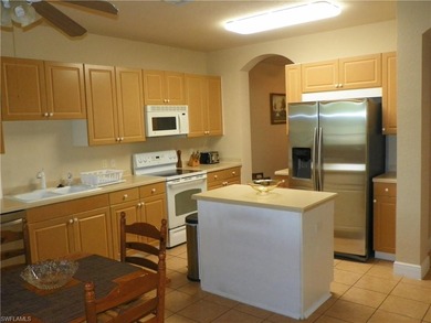 Second floor unit with lake view. Open floor plan with split on Spanish Wells Golf and Country Club in Florida - for sale on GolfHomes.com, golf home, golf lot