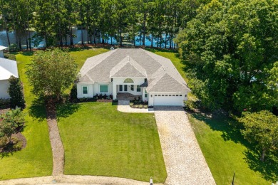 Situated on a spacious 1/2 acre lot boasting 177 ft of lake on Santa Rosa Golf and Beach Club in Florida - for sale on GolfHomes.com, golf home, golf lot