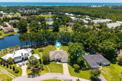 Situated on a spacious 1/2 acre lot boasting 177 ft of lake on Santa Rosa Golf and Beach Club in Florida - for sale on GolfHomes.com, golf home, golf lot