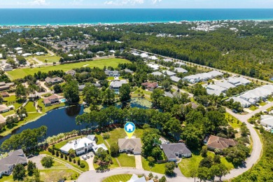 Situated on a spacious 1/2 acre lot boasting 177 ft of lake on Santa Rosa Golf and Beach Club in Florida - for sale on GolfHomes.com, golf home, golf lot