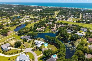 Situated on a spacious 1/2 acre lot boasting 177 ft of lake on Santa Rosa Golf and Beach Club in Florida - for sale on GolfHomes.com, golf home, golf lot
