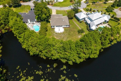 Situated on a spacious 1/2 acre lot boasting 177 ft of lake on Santa Rosa Golf and Beach Club in Florida - for sale on GolfHomes.com, golf home, golf lot