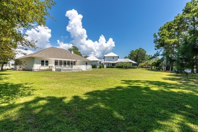 Situated on a spacious 1/2 acre lot boasting 177 ft of lake on Santa Rosa Golf and Beach Club in Florida - for sale on GolfHomes.com, golf home, golf lot