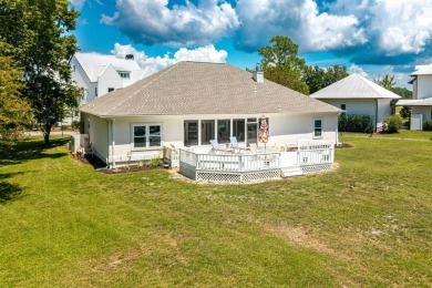 Situated on a spacious 1/2 acre lot boasting 177 ft of lake on Santa Rosa Golf and Beach Club in Florida - for sale on GolfHomes.com, golf home, golf lot