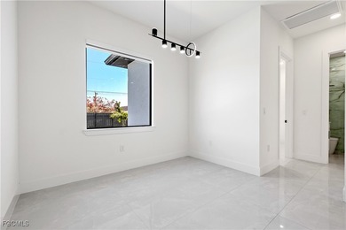 Discover refined Florida living in this exquisite 2024-built on Palmetto-Pine Country Club in Florida - for sale on GolfHomes.com, golf home, golf lot