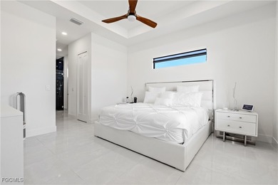 Discover refined Florida living in this exquisite 2024-built on Palmetto-Pine Country Club in Florida - for sale on GolfHomes.com, golf home, golf lot