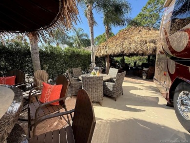 YOUR TROPICAL OASIS AWAITS! Ideally situated near the north on Motorcoach Resort Golf Course in Florida - for sale on GolfHomes.com, golf home, golf lot