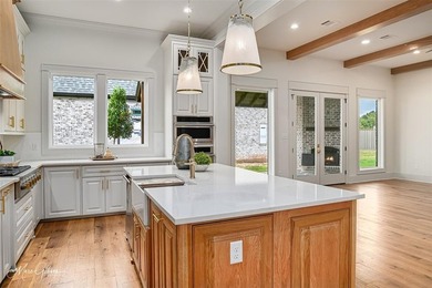 This breathtaking two story home blends modern French country on The Golf Club At StoneBridge in Louisiana - for sale on GolfHomes.com, golf home, golf lot