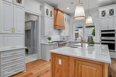 This breathtaking two story home blends modern French country on The Golf Club At StoneBridge in Louisiana - for sale on GolfHomes.com, golf home, golf lot