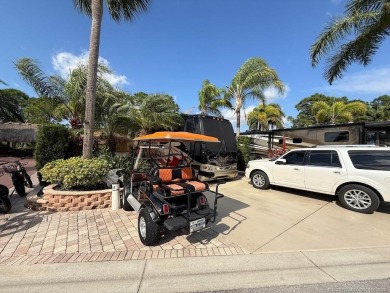 YOUR TROPICAL OASIS AWAITS! Ideally situated near the north on Motorcoach Resort Golf Course in Florida - for sale on GolfHomes.com, golf home, golf lot