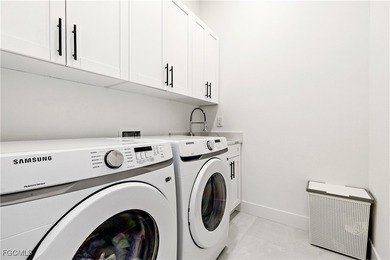 Discover refined Florida living in this exquisite 2024-built on Palmetto-Pine Country Club in Florida - for sale on GolfHomes.com, golf home, golf lot