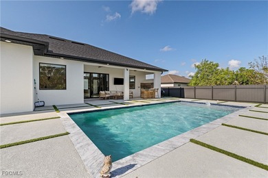 Discover refined Florida living in this exquisite 2024-built on Palmetto-Pine Country Club in Florida - for sale on GolfHomes.com, golf home, golf lot