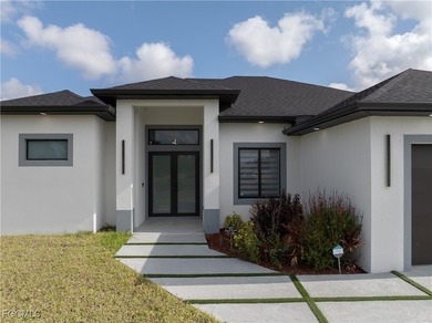 Discover refined Florida living in this exquisite 2024-built on Palmetto-Pine Country Club in Florida - for sale on GolfHomes.com, golf home, golf lot