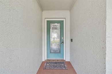 Welcome to this beautifully maintained 3-bedroom, 2-bath pool on Oak Hills Country Club in Florida - for sale on GolfHomes.com, golf home, golf lot