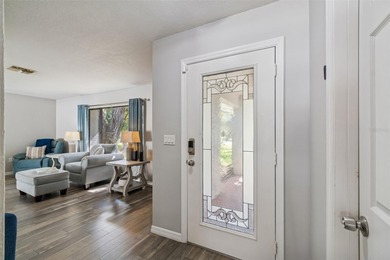 Welcome to this beautifully maintained 3-bedroom, 2-bath pool on Oak Hills Country Club in Florida - for sale on GolfHomes.com, golf home, golf lot