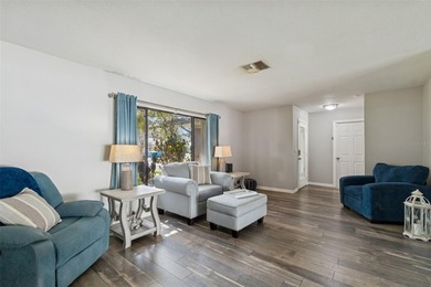 Welcome to this beautifully maintained 3-bedroom, 2-bath pool on Oak Hills Country Club in Florida - for sale on GolfHomes.com, golf home, golf lot