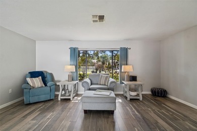 Welcome to this beautifully maintained 3-bedroom, 2-bath pool on Oak Hills Country Club in Florida - for sale on GolfHomes.com, golf home, golf lot