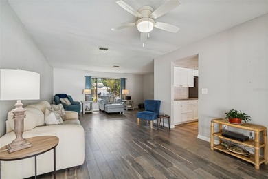 Welcome to this beautifully maintained 3-bedroom, 2-bath pool on Oak Hills Country Club in Florida - for sale on GolfHomes.com, golf home, golf lot