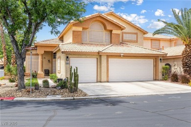 This stunning two-story residence offers 5 spacious bedrooms and on Painted Desert Golf Club in Nevada - for sale on GolfHomes.com, golf home, golf lot