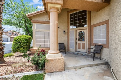 This stunning two-story residence offers 5 spacious bedrooms and on Painted Desert Golf Club in Nevada - for sale on GolfHomes.com, golf home, golf lot