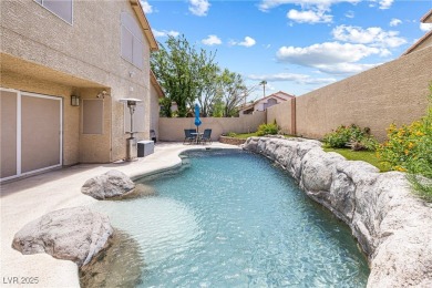 This stunning two-story residence offers 5 spacious bedrooms and on Painted Desert Golf Club in Nevada - for sale on GolfHomes.com, golf home, golf lot